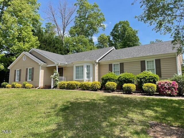 6220 Sweden Dr, Raleigh, NC 27612 - ranch-style house featuring a front lawn