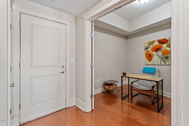 entryway with hardwood / wood-style floors