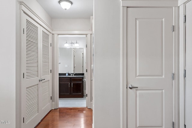 hallway with dark hardwood / wood-style floors