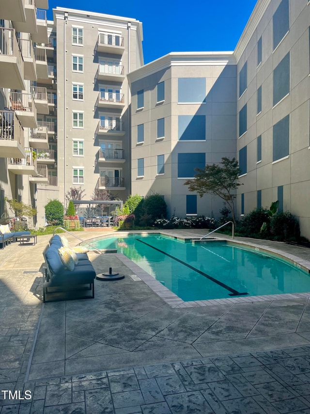 view of swimming pool featuring a patio