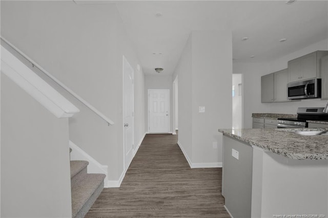 corridor with dark wood-type flooring