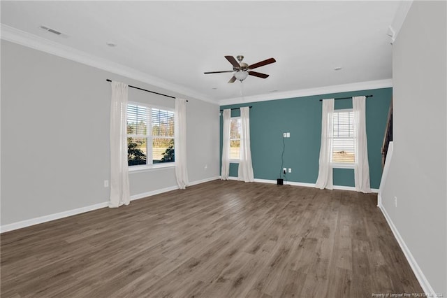 unfurnished room with crown molding, hardwood / wood-style floors, ceiling fan, and a healthy amount of sunlight