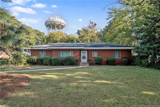 ranch-style house with a front lawn