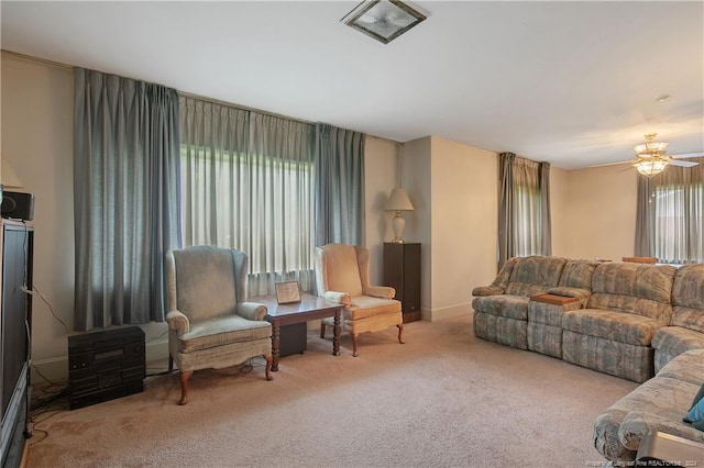 living room featuring ceiling fan, a healthy amount of sunlight, and carpet floors