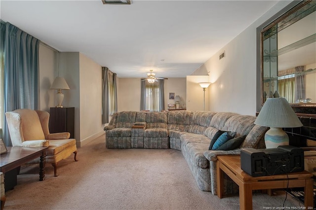 living room with carpet and ceiling fan