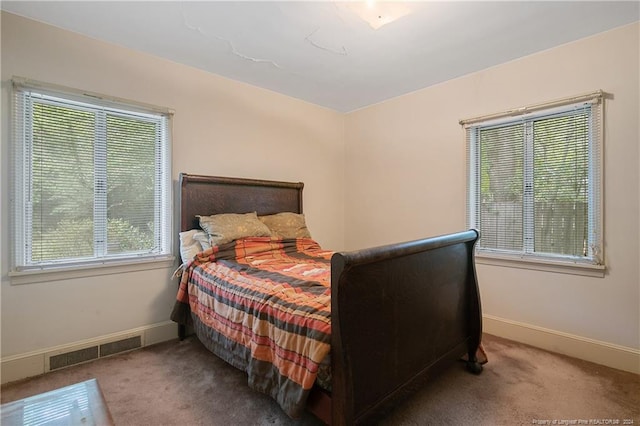 bedroom featuring carpet