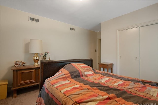 bedroom with carpet floors and a closet