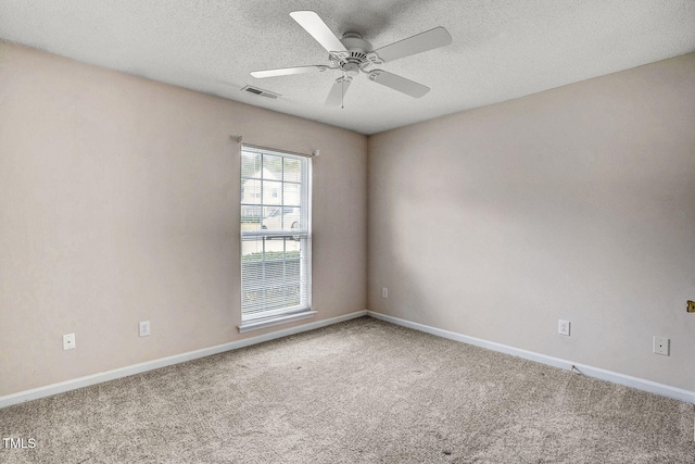 unfurnished room featuring carpet flooring, a textured ceiling, and ceiling fan