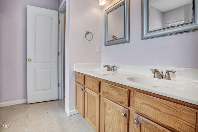 bathroom with vanity, tile patterned floors, and a textured ceiling