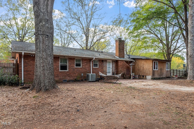 rear view of property featuring central air condition unit