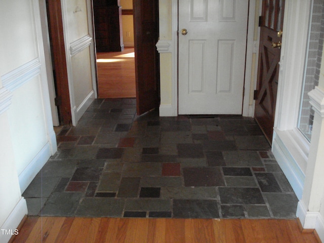 hallway with dark hardwood / wood-style floors