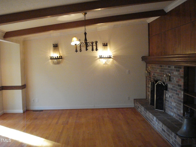 unfurnished living room featuring hardwood / wood-style floors, beamed ceiling, crown molding, and a brick fireplace