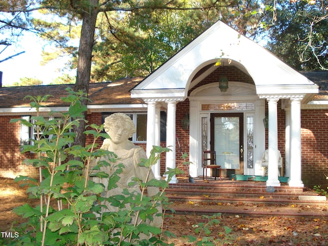 doorway to property featuring a porch