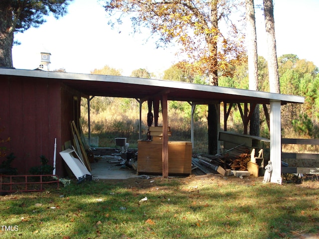 view of car parking featuring a yard