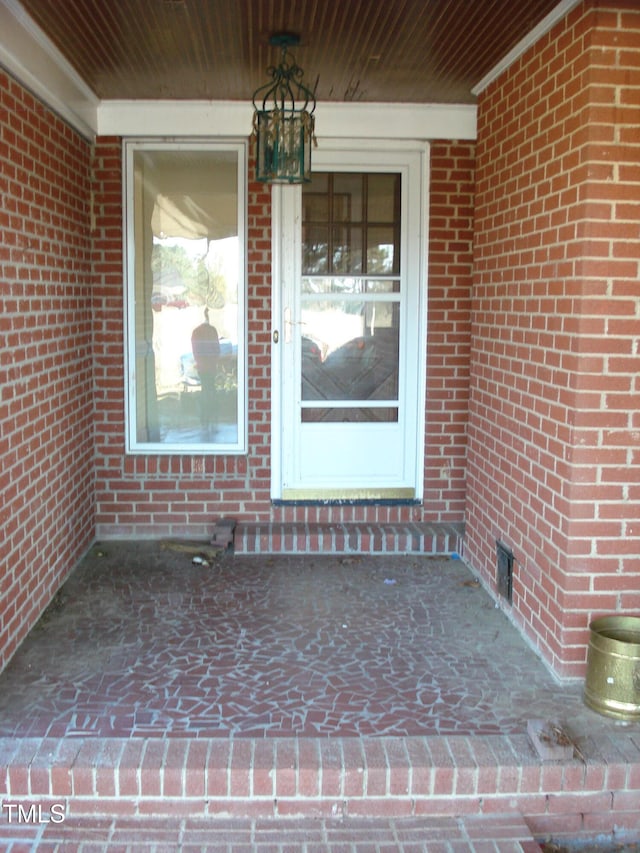 doorway to property with a porch