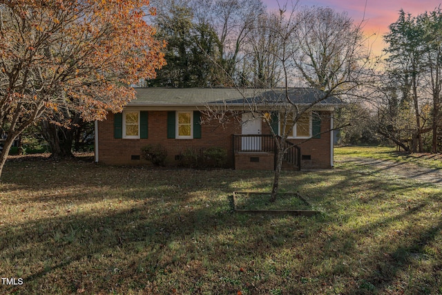 view of front of home with a yard