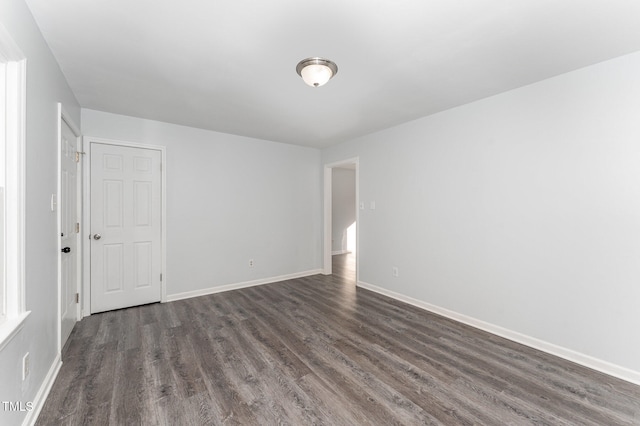 empty room featuring dark hardwood / wood-style floors