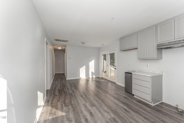 unfurnished living room featuring dark hardwood / wood-style flooring