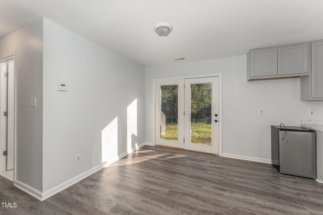 unfurnished dining area with dark hardwood / wood-style floors