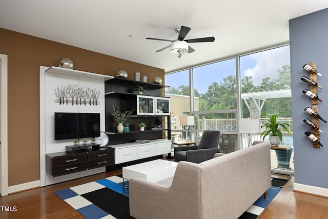 living room with hardwood / wood-style floors and ceiling fan