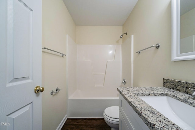 full bathroom with vanity, toilet, bathing tub / shower combination, and hardwood / wood-style flooring