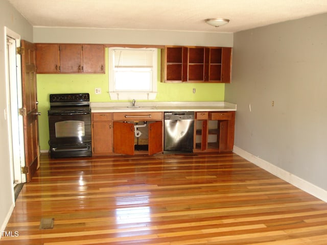 kitchen with dishwasher, light hardwood / wood-style flooring, sink, and black range with electric stovetop