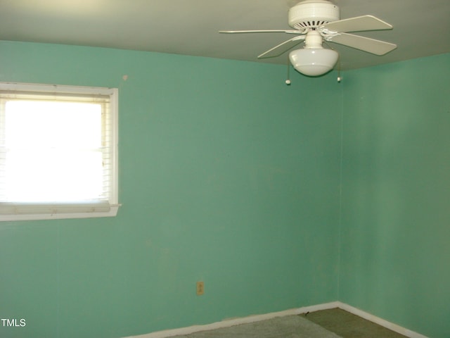 unfurnished room with a wealth of natural light and ceiling fan