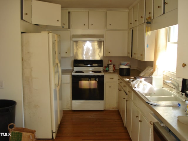 kitchen featuring white cabinets, dark hardwood / wood-style flooring, sink, and white appliances