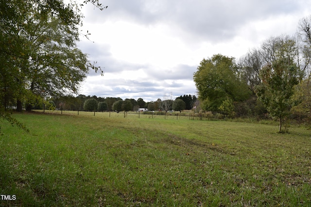 view of yard with a rural view