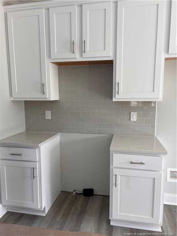 kitchen with light countertops, tasteful backsplash, and visible vents