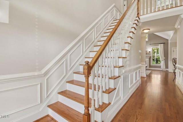 stairs featuring wood-type flooring