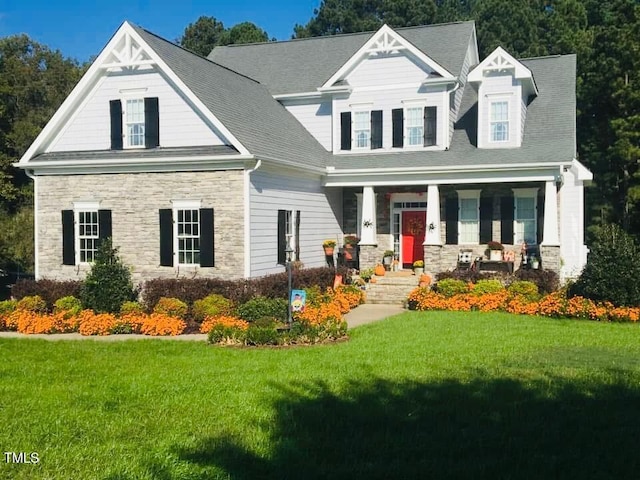 view of front of home featuring a front lawn and a porch