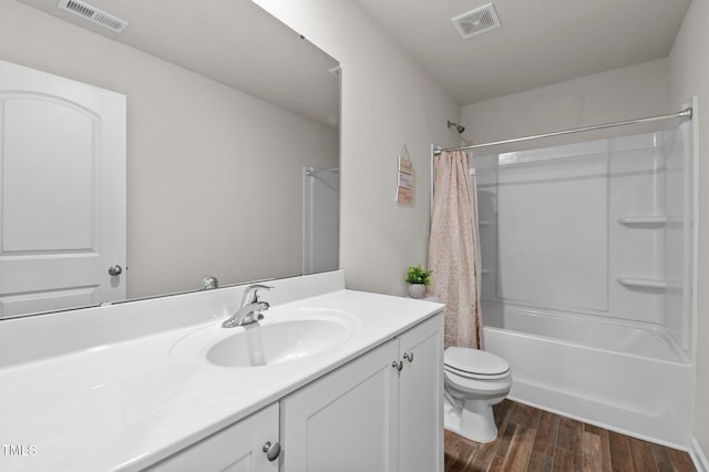 full bathroom featuring vanity, toilet, shower / bath combination with curtain, and wood-type flooring