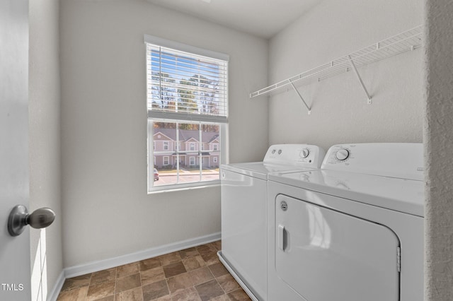 washroom featuring washer and dryer