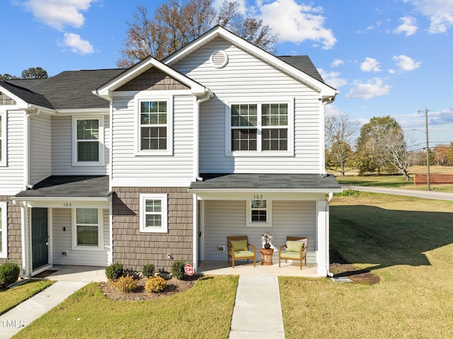 view of front of property with a front lawn and a patio