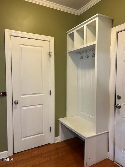 mudroom with wood-type flooring and crown molding