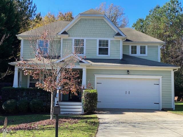 view of front of house with a front lawn and a garage