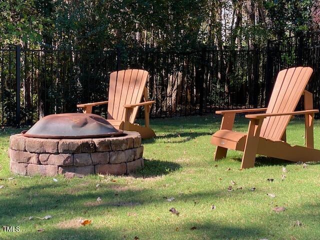 view of yard with an outdoor fire pit