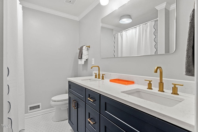 bathroom with tile patterned floors, crown molding, vanity, and toilet