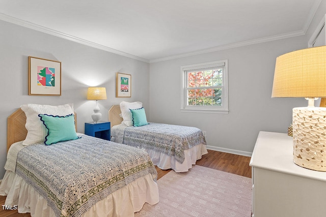 bedroom with wood-type flooring and crown molding