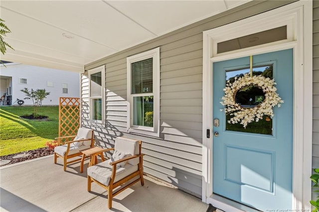 entrance to property featuring covered porch