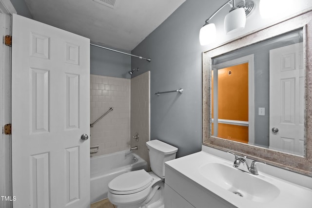 full bathroom with vanity, toilet, and tiled shower / bath