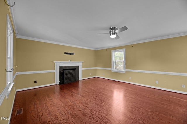 unfurnished living room with wood-type flooring, ceiling fan, and crown molding