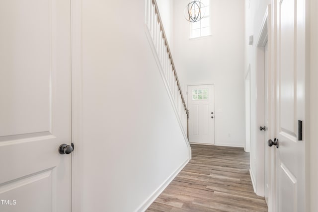 hallway with light hardwood / wood-style flooring