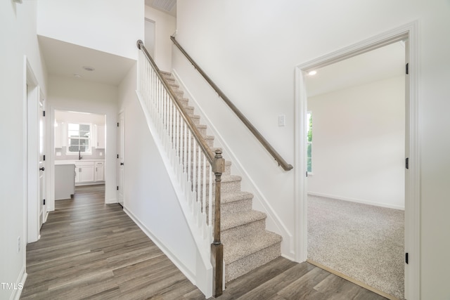 stairway with wood-type flooring