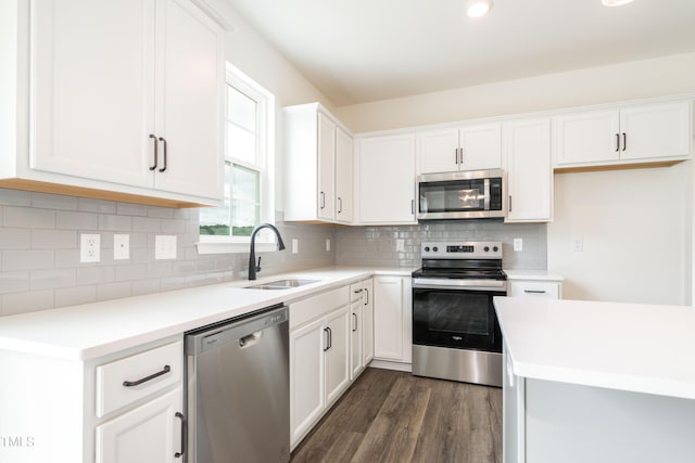 kitchen with white cabinetry, appliances with stainless steel finishes, and sink