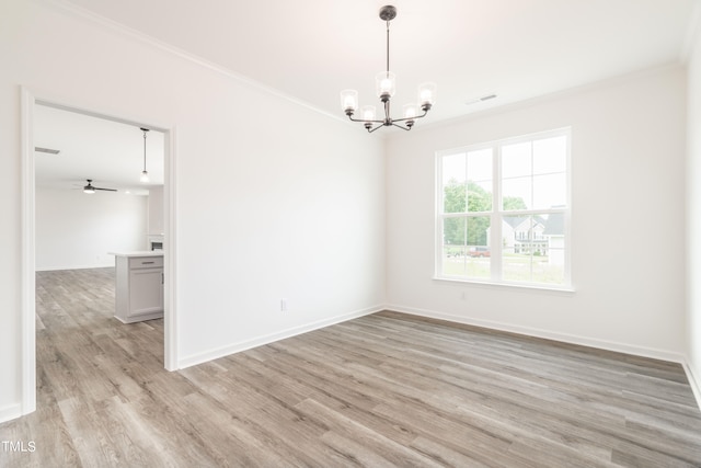 spare room featuring ceiling fan with notable chandelier, light hardwood / wood-style flooring, and ornamental molding