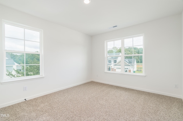 unfurnished room featuring carpet floors