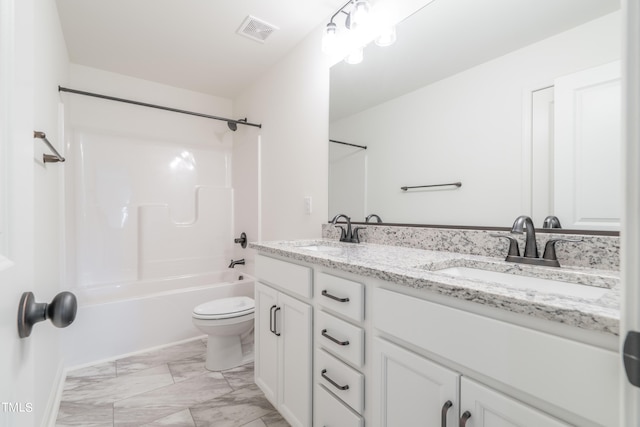 full bathroom featuring vanity, toilet, and  shower combination