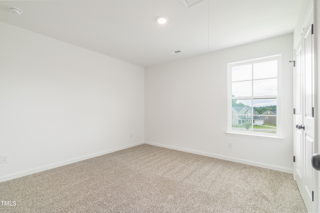 empty room with light colored carpet